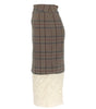 Plaid skirt with a textured white bottom section on a white background