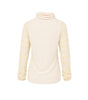 Cream-colored turtleneck sweater on a white background