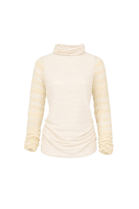 Cream-colored turtleneck sweater on a white background