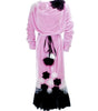 Pink dress with black floral accents on a white background