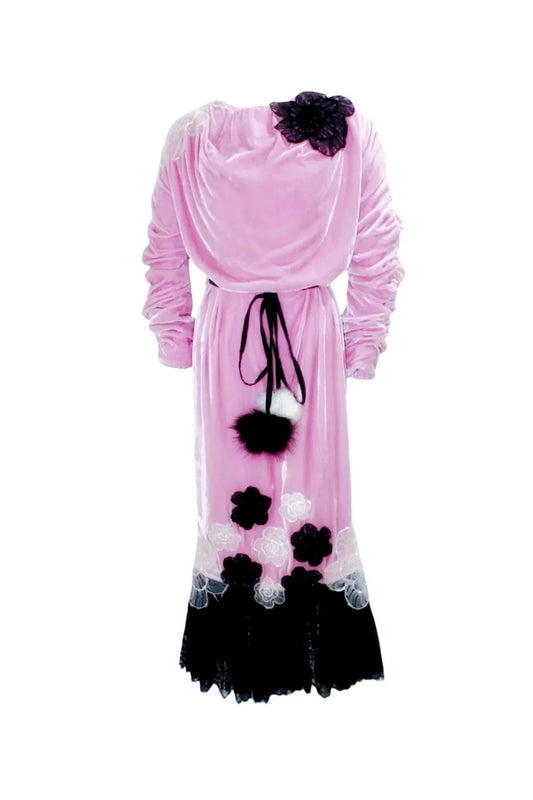Pink dress with black floral accents on a white background