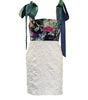 Dress with floral top and textured skirt on a white background