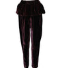 Dark purple velvet pants with a ruffled top on a white background