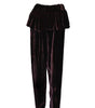 Pair of dark purple velvet pants with a ruffled top on a white background