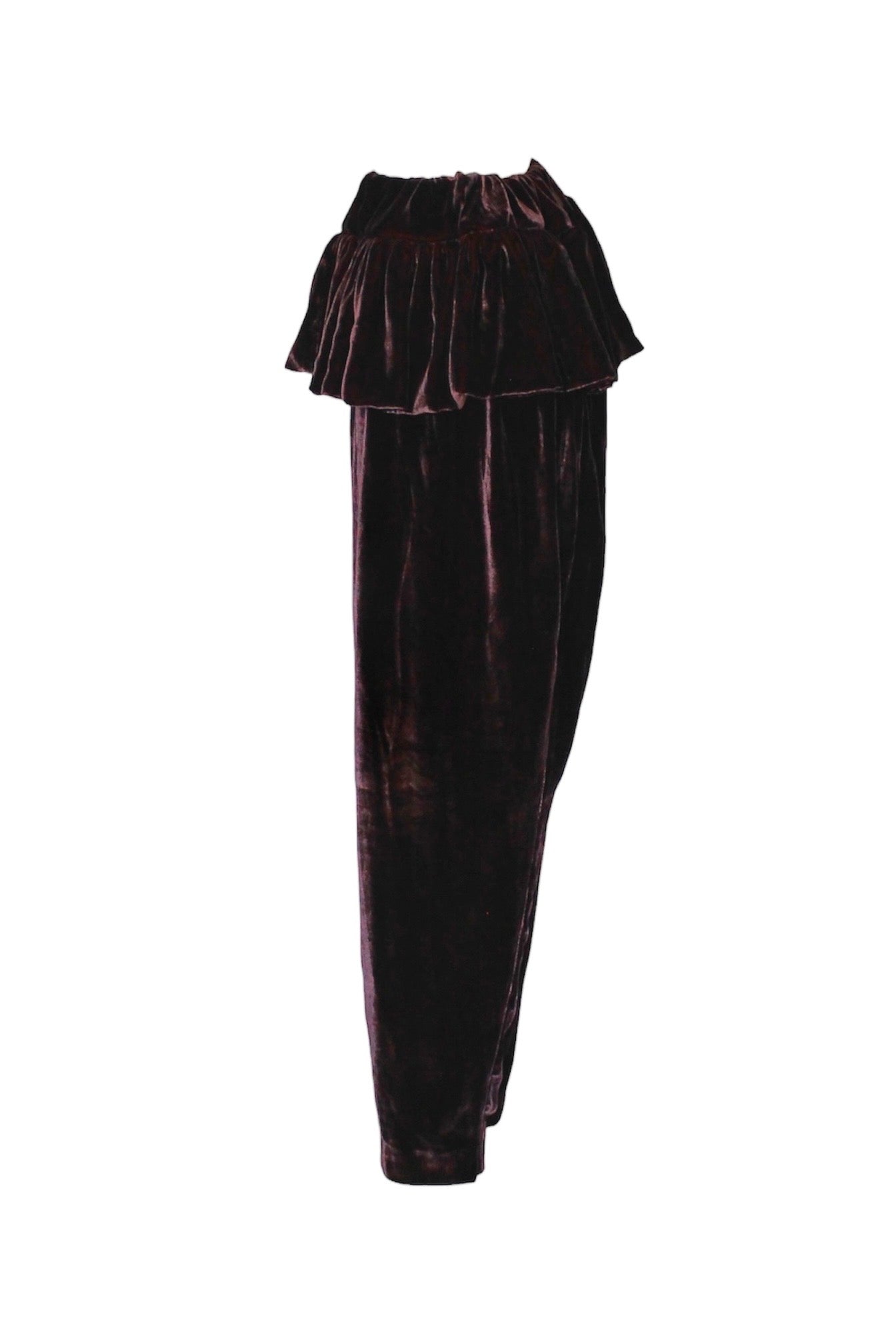 Black velvet pants with a ruffled top on a white background
