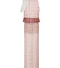 Pink dress with white polka dots and ruffled layers on a white background