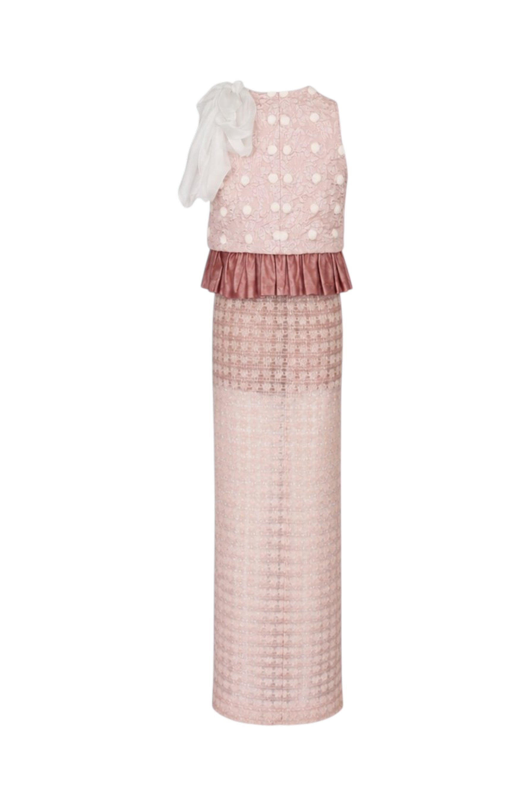 Pink dress with white polka dots and ruffled layers on a white background