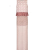 Pink dress with polka dot top and textured skirt on a white background
