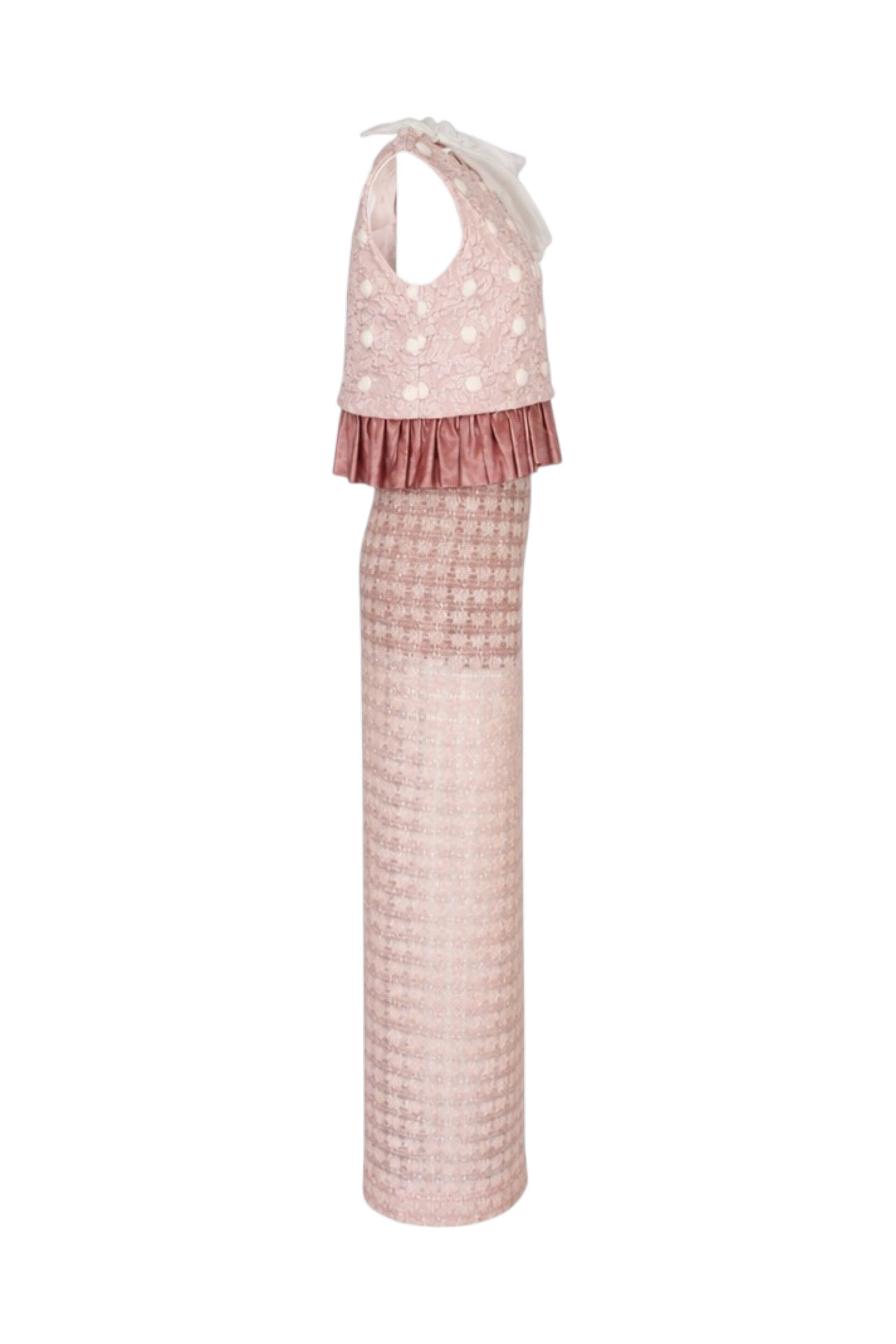 Pink dress with polka dot top and checkered skirt on a white background