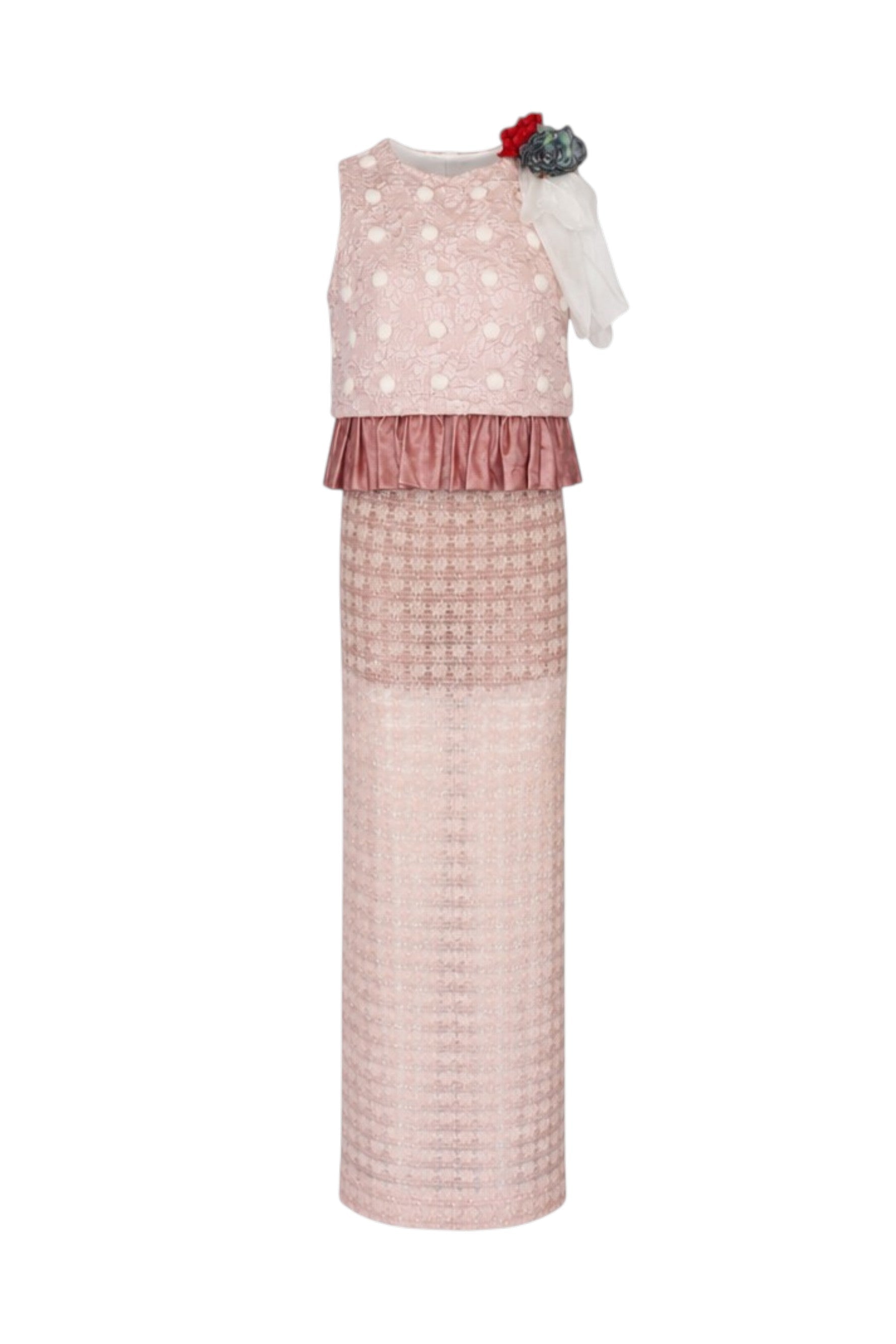 Pink dress with polka dot top and textured skirt on a white background