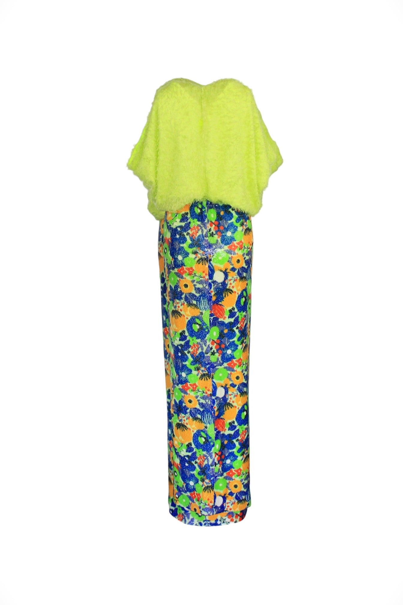 Green top and colorful patterned pants on a white background