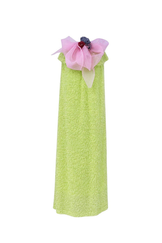 Green dress with pink floral embellishments on a white background