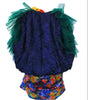 Colorful children's outfit with a blue top and multicolored bottom on a white background
