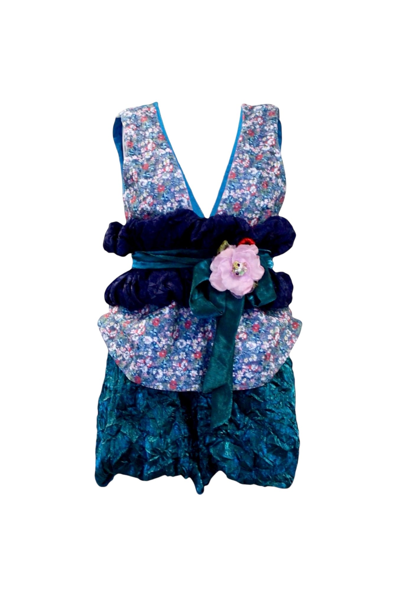 Floral and textured dress with decorative elements on a white background