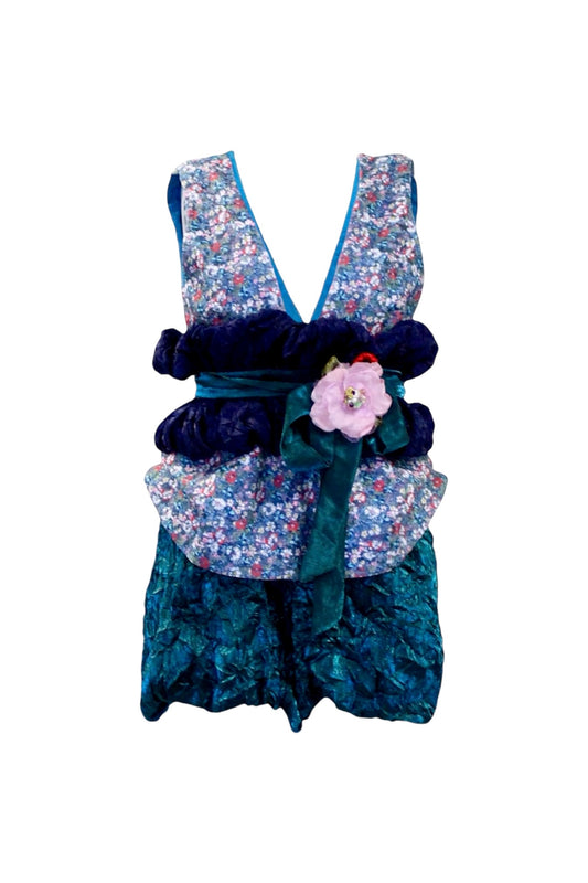 Floral and textured dress with decorative elements on a white background