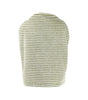 Textured green and white vase on a white background