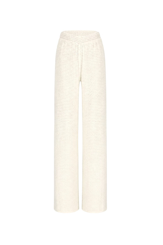White textured pants on a white background