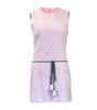White apron with pink floral pattern on a white background